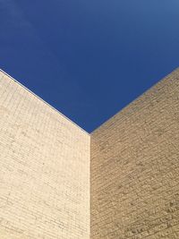 Low angle view of building against blue sky