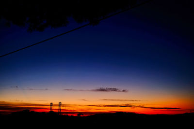 Scenic view of silhouette landscape against sky at sunset