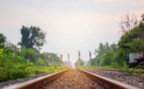 Railroad at thailand train station. platform of the rural station with the traffic signal pole.