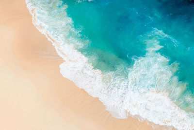 Beach and waves from top view.