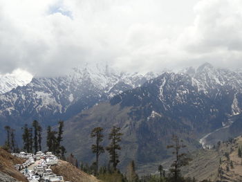 Scenic view of snowcapped mountains against sky