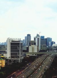 High angle view of buildings in city against sky