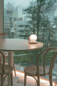 Empty chairs and table at restaurant