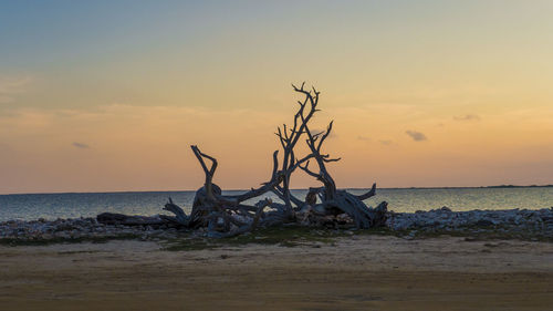 Scenic view of sea against sky at sunset