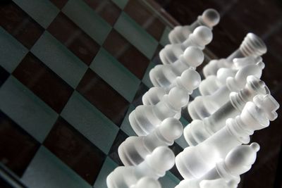 High angle view of white chess pieces on table