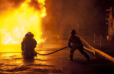 Firefighters extinguishing fire