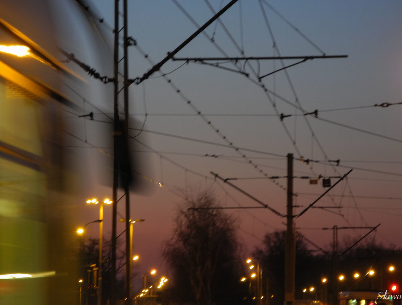 LOW ANGLE VIEW OF ILLUMINATED STREET LIGHT AGAINST SKY