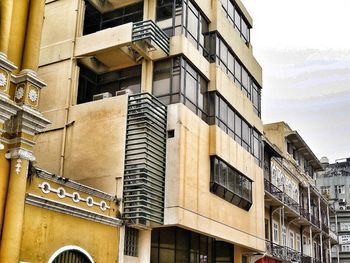 Low angle view of building in city against sky