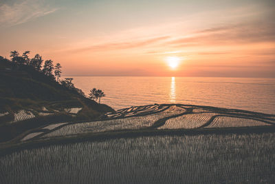 Scenic view of sea against sky during sunset