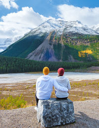 Rear view of woman looking at lake