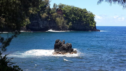 Scenic view of sea against blue sky