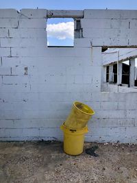 Low angle view of weathered wall of building