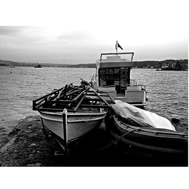 water, nautical vessel, sea, boat, moored, transportation, mode of transport, sky, tranquility, tranquil scene, built structure, nature, pier, outdoors, no people, day, horizon over water, absence, auto post production filter, clear sky