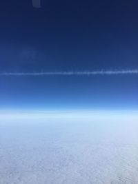 Scenic view of landscape against blue sky