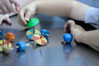 High angle view of babys playing with toys on table