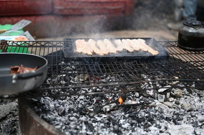 High angle view of meat on barbecue grill