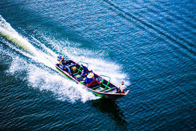 High angle view of people in boat on sea