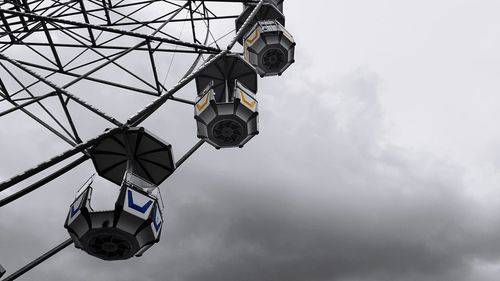 Low angle view of ferris wheel against sky