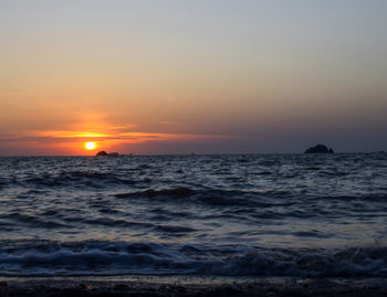Scenic view of sea against sky during sunset