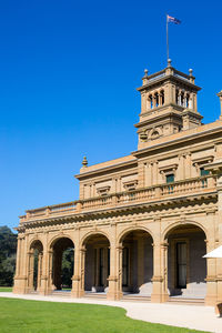 Low angle view of building against blue sky