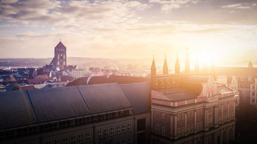 Cityscape against sky during sunset