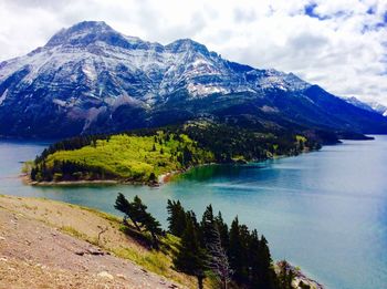 Scenic view of mountains and lake against sky