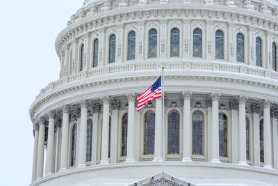 Low angle view of flag against building