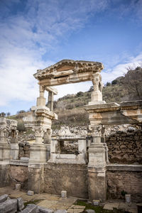 Old ruins of temple against cloudy sky