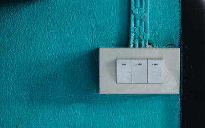 Close-up of telephone booth on wall