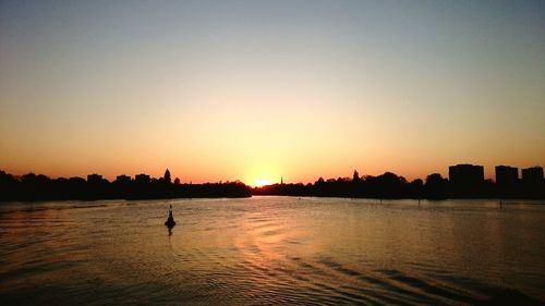 Silhouette of city at sunset