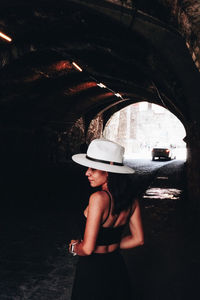 Midsection of woman standing by bridge