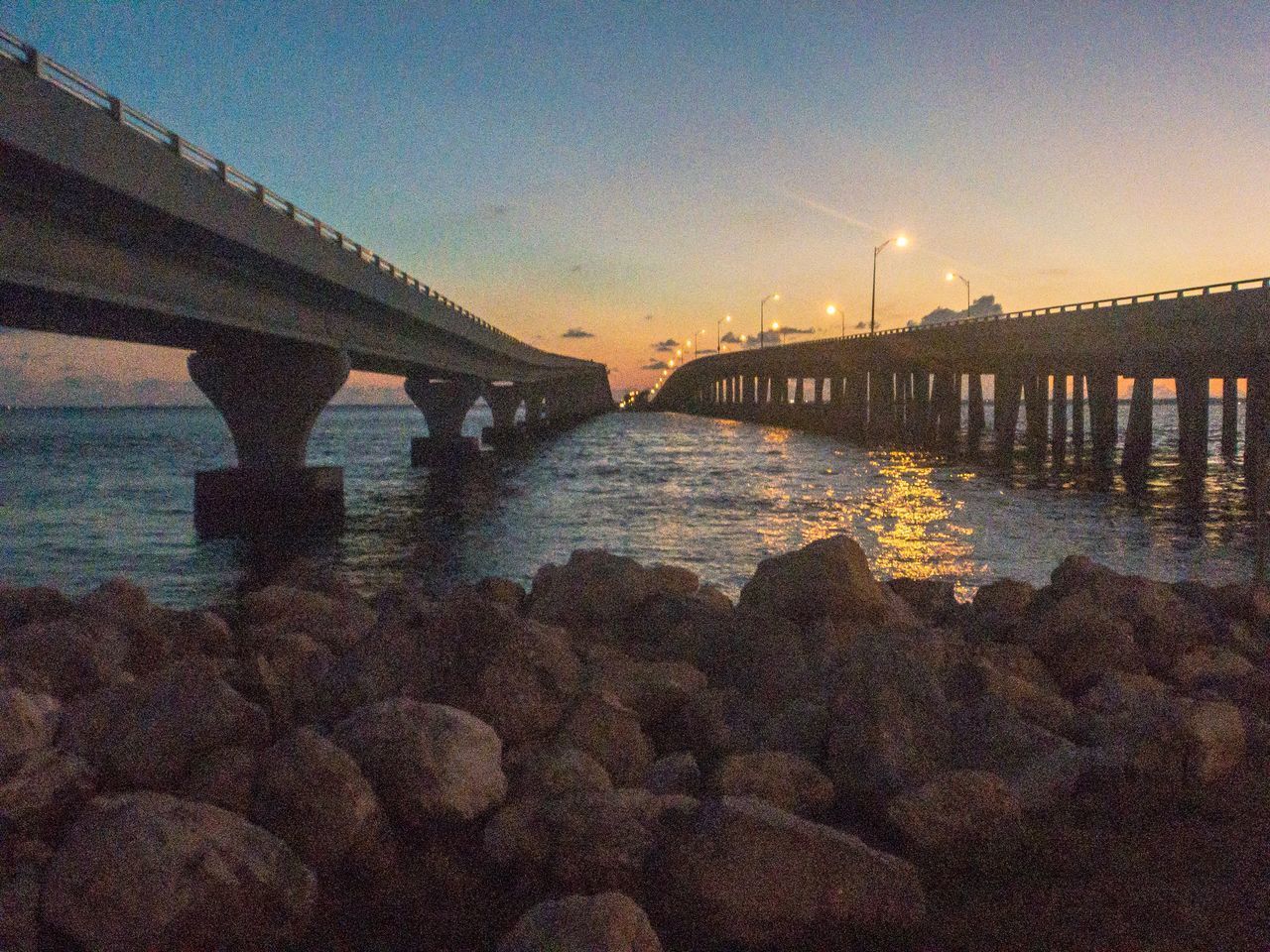 VIEW OF BRIDGE OVER RIVER AGAINST SKY