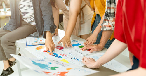 Group of people working on table