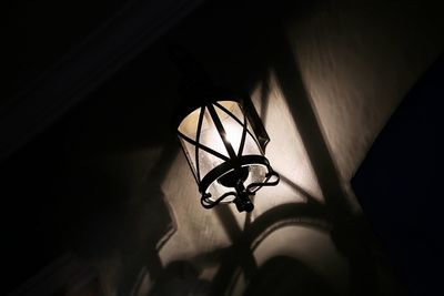 Low angle view of illuminated lamp at home