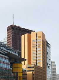 Low angle view of modern buildings against clear sky