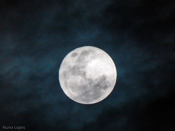 Low angle view of moon against sky at night