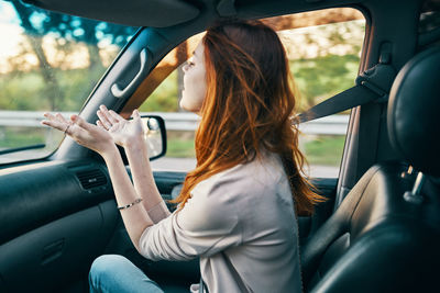 Woman sitting in car