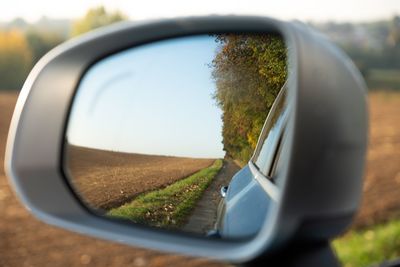 Reflection of road on side-view mirror