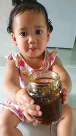 Portrait of cute baby at home