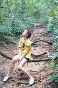 Full length of woman in forest