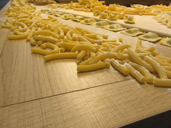 High angle view of raw pastas on table