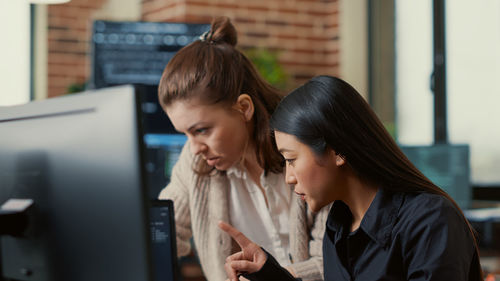 Computer programmers working at office