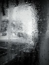 Close-up of water drops on glass