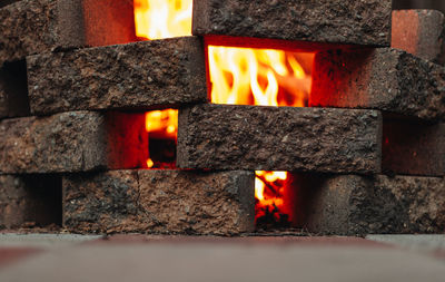 Close-up of burning candles on wood