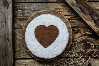 Close-up of heart shape made on wood