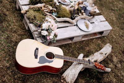 High angle view of guitar on field