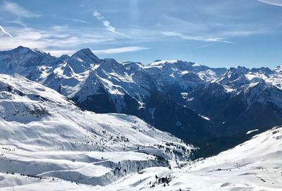 Scenic view of snowcapped mountains against sky