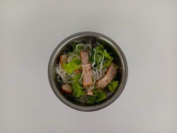 High angle view of food in bowl on white background