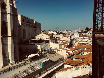 High angle view of buildings in city against clear sky