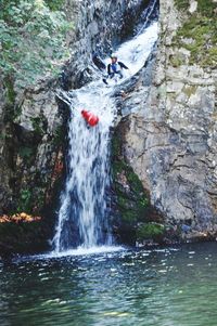 Scenic view of waterfall in water